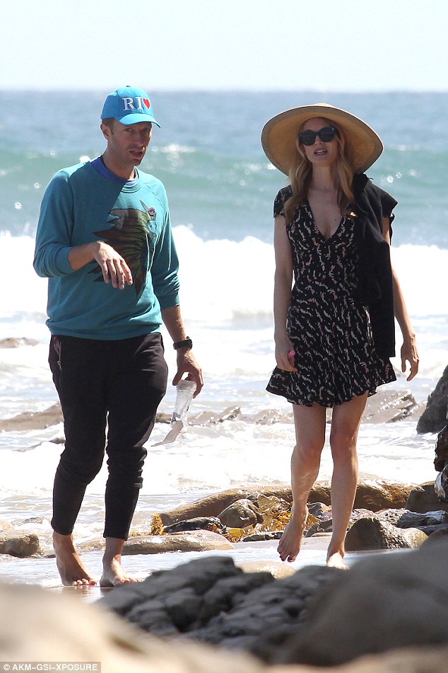 Chris Martin and new girlfriend Annabelle Wallis go for a romantic stroll on the beach together on a sunny Sunday
