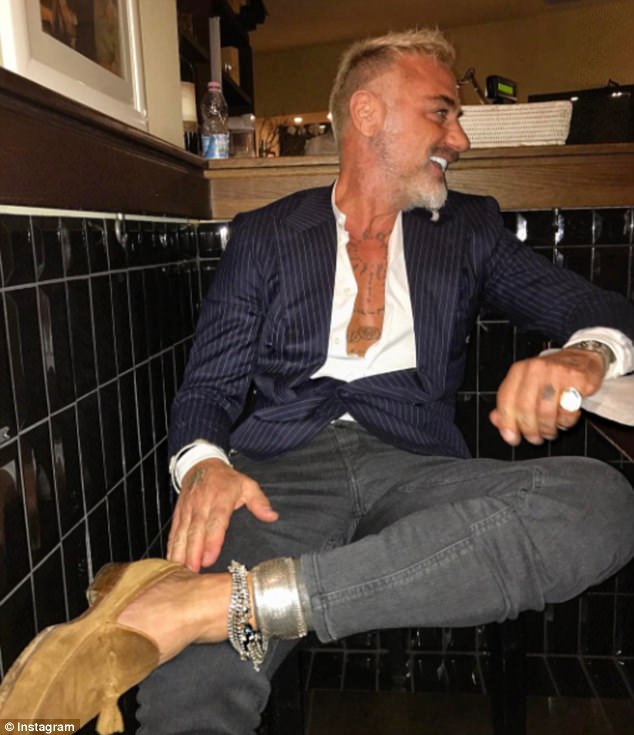 Proving that age is just a number, the 49-year-old not only has an enviably buff physique - he also appears to enjoy a non-stop social life (pictured here enjoying a recent night out)